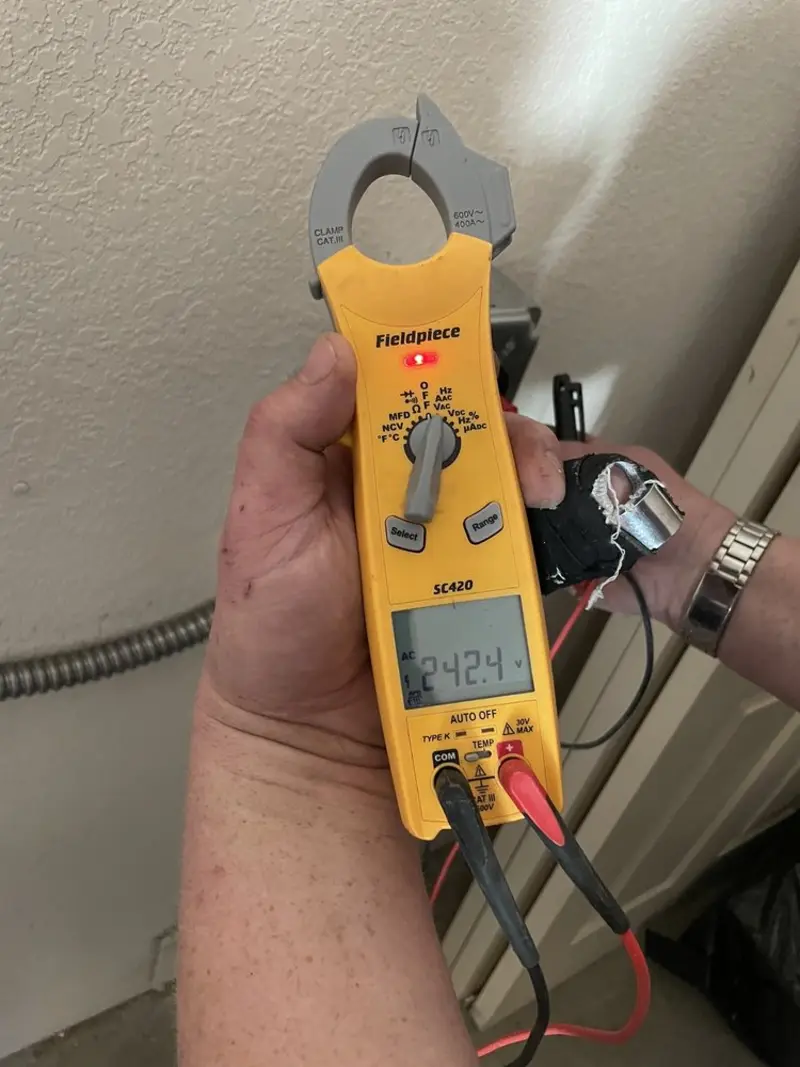 Voltage testing with clamp meter during Generator Installation in Vero Lake Estates